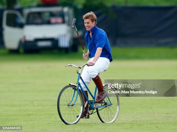 Prince William takes part in a charity Jockeys v Eventers bicycle polo match at Tidworth Polo Club on July 13, 2002 in Tidworth, England.