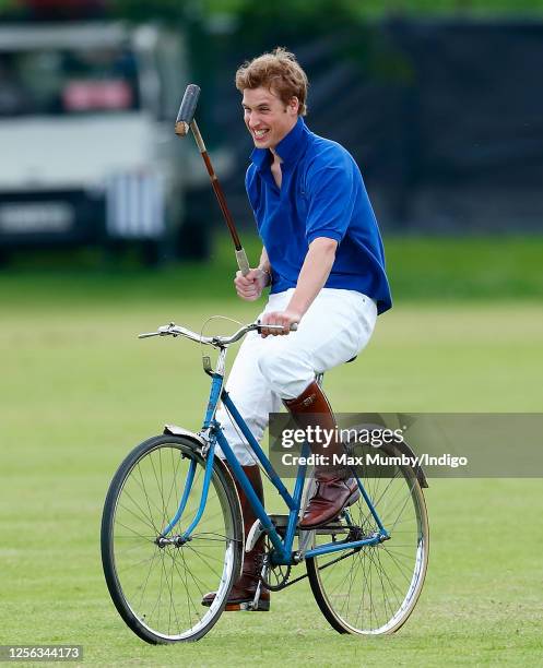 Prince William takes part in a charity Jockeys v Eventers bicycle polo match at Tidworth Polo Club on July 13, 2002 in Tidworth, England.