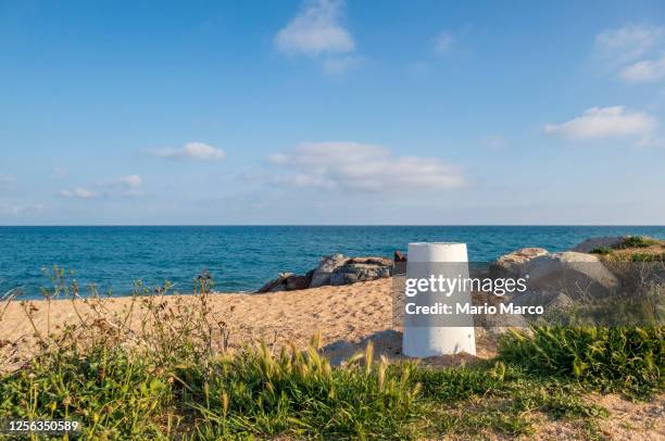 bollard on the beach - maresme stock pictures, royalty-free photos & images