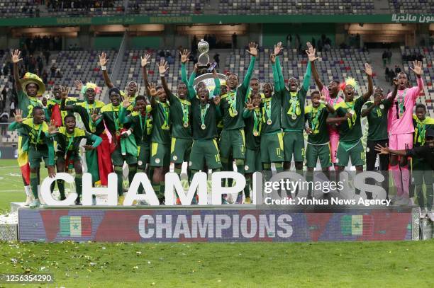 Senegal's players celebrate with the trophy during the awarding ceremony of the U17 Africa Cup of Nations at Nelson Mandela Stadium in Algiers,...