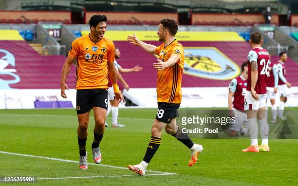 Raul Jimenez of Wolverhampton Wanderers celebrates with teammate Diogo Jota after scoring his sides first goal during the Premier League match...