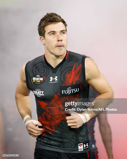 Zach Merrett of the Bombers enters the field during the 2023 AFL Round 10 match between the Essendon Bombers and the Richmond Tigers at the Melbourne...