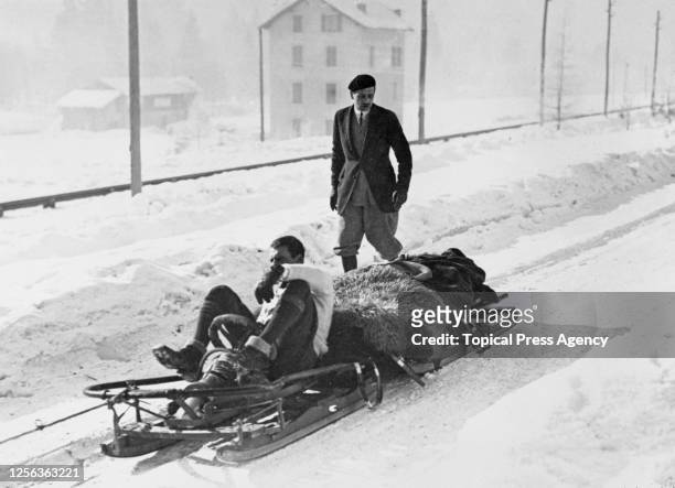 Bringing down the injured following a bobsleigh crash at the 1924 Winter Olympics in Chamonix, France, February 1924.