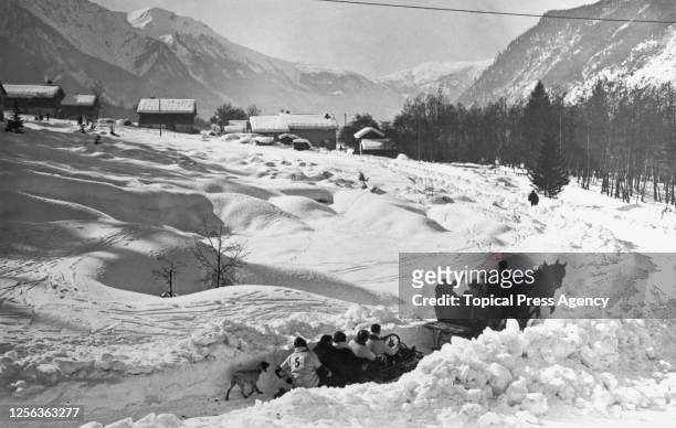 The competitors being taken to the starting point of the bobsleigh event of the 1924 Winter Olympics, at the Piste de Bobsleigh des Pellerins, a...