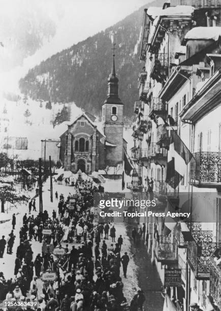Delegates of the competing nations gathered near Saint-Michel Church and the Hotel de Ville for the opening ceremony of the 1924 Winter Olympics in...
