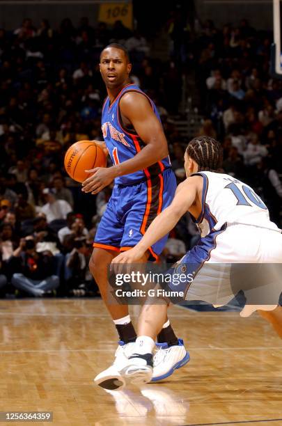 Charlie Ward of the New York Knicks handles the ball against the Washington Wizards at the MCI Center on December 7, 2002 in Washington, DC. NOTE TO...