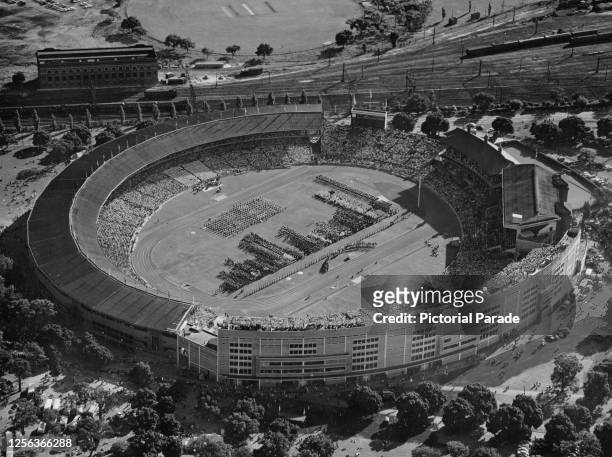 Aerial view of the opening ceremony of the 1956 Summer Olympics, the stands packed with spectators at Melbourne Cricket Ground in Melbourne,...