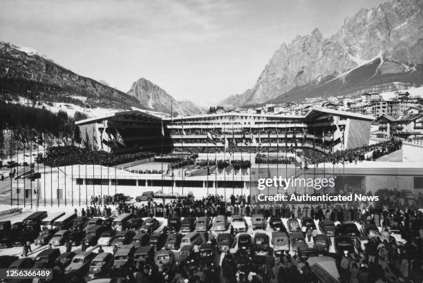 The opening ceremony of the 1956 Winter Olympics at the Olympic Ice Stadium , the Dolomites visible beyond, in Cortina d'Ampezzo, Italy, 26th January...