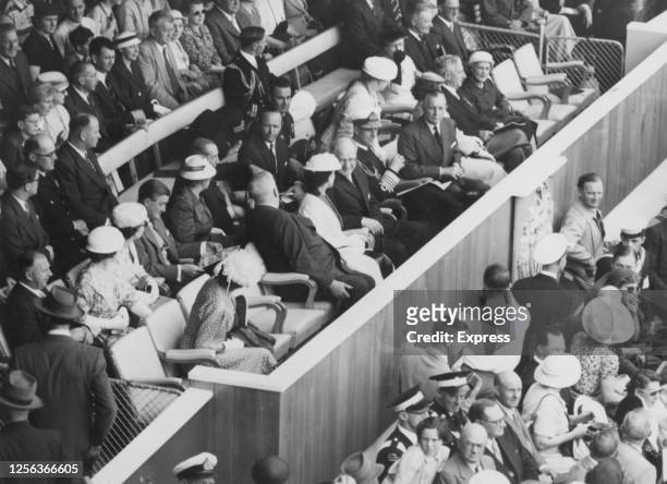 Prince Philip, Duke of Edinburgh, in naval uniform, among the dignitaries watching the parade of athletes at the opening ceremony of the 1956 Summer...