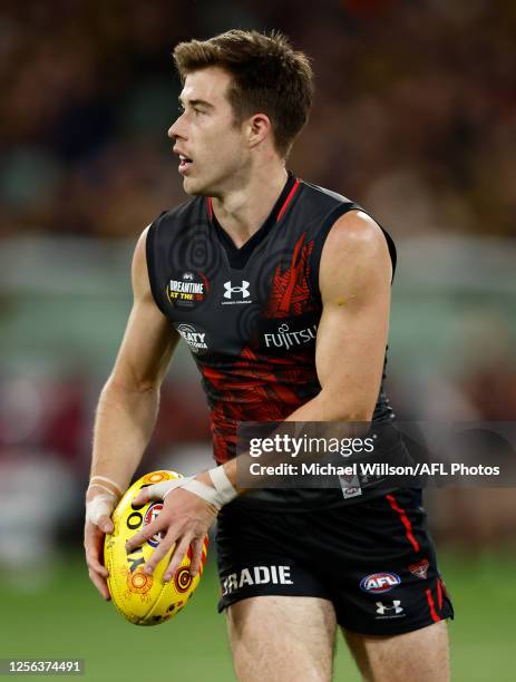 Zach Merrett of the Bombers in action during the 2023 AFL Round 10 match between the Essendon Bombers and the Richmond Tigers at the Melbourne...