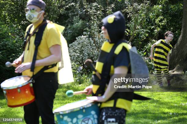 Protesters gather dressed in bee costumes before marching into the city centre on May 20, 2023 in Bury St Edmunds, United Kingdom. On World Bee Day,...
