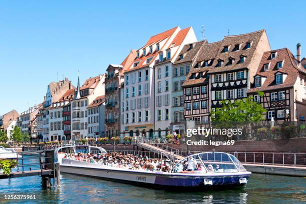 tourist canal cruise in strasbourg during epidemic covid 19 - bateau mouche stock pictures, royalty-free photos & images