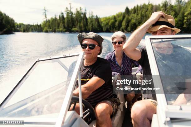 50+ friends enjoying vacations on a small boat. - lake boat stock pictures, royalty-free photos & images