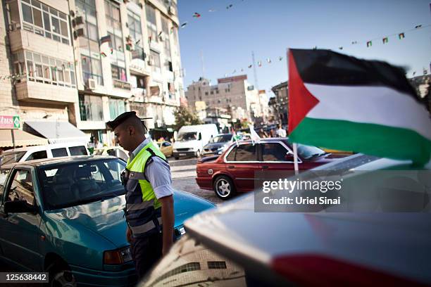 Man getisn in a car with Palestinian flags September 19, 2011 in Ramallah, West Bank. Palestinian President Mahmoud Abbas is reportedly told United...