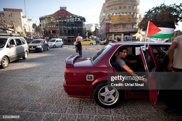 Man getisn in a car with Palestinian flags September 19, 2011 in Ramallah, West Bank. Palestinian President Mahmoud Abbas is reportedly told United...