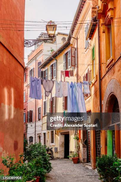 trastevere neighbourhood in rome, italy - narrow stock pictures, royalty-free photos & images