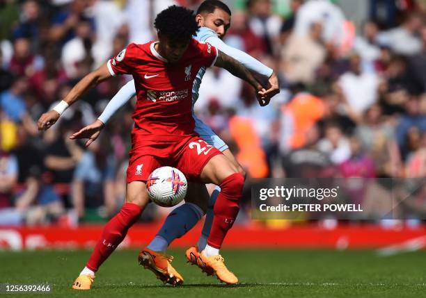 Liverpool's Colombian midfielder Luis Diaz vies with Aston Villa's Brazilian midfielder Douglas Luiz during the English Premier League football match...