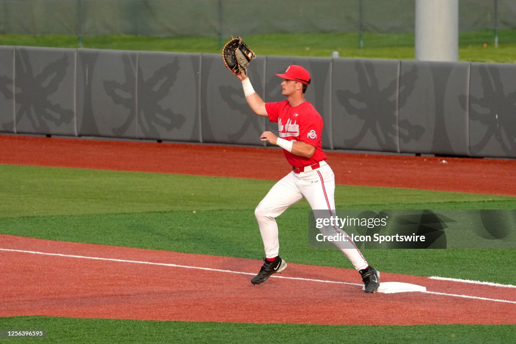 Caiden Kaiser of the Ohio State Buckeyes catches a ball at first base ...