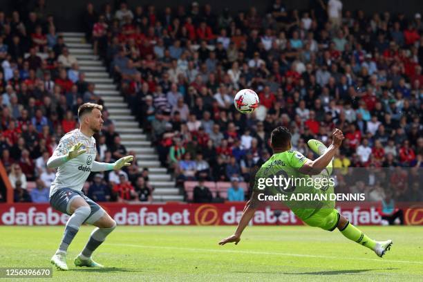 Manchester United's Brazilian midfielder Casemiro scores the opening goal past Bournemouth's Brazilian goalkeeper Neto during the English Premier...