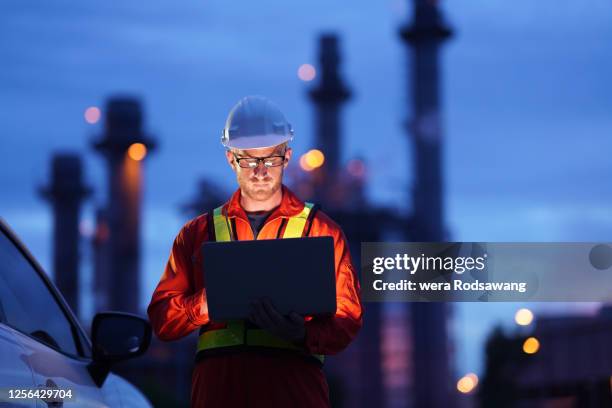 engineer working at construction power plant - builder standing isolated stock-fotos und bilder