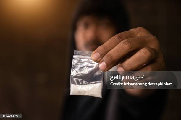 heroin,man is taking heroin, drug addict, disease - drug dealer stock-fotos und bilder