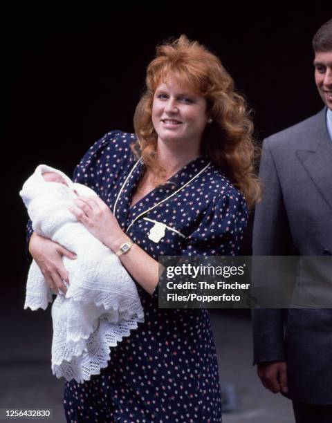 Sarah, The Duchess of York holding her infant daughter Princess Beatrice with HRH Prince Andrew , outside the Portland Hospital in London on 8th...