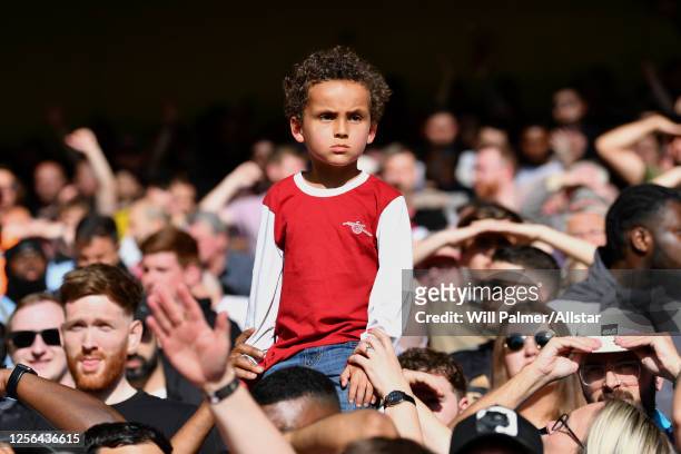 A young Arsenal Fan before the Premier League match between Nottingham Forest and Arsenal FC at City Ground on May 20, 2023 in Nottingham, England.