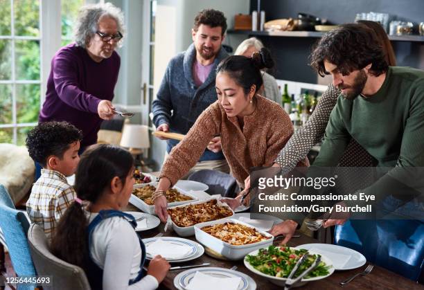 extended family having meal together - tipo di cibo foto e immagini stock