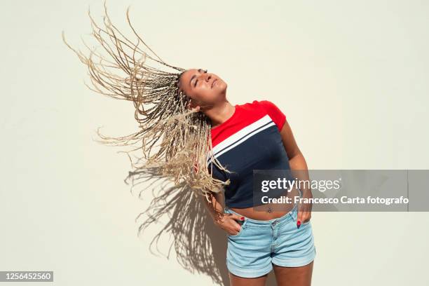 hispanic female flicking hair - belly dancer stockfoto's en -beelden