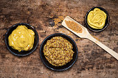 Wholegrain mustard in a bowl on a table