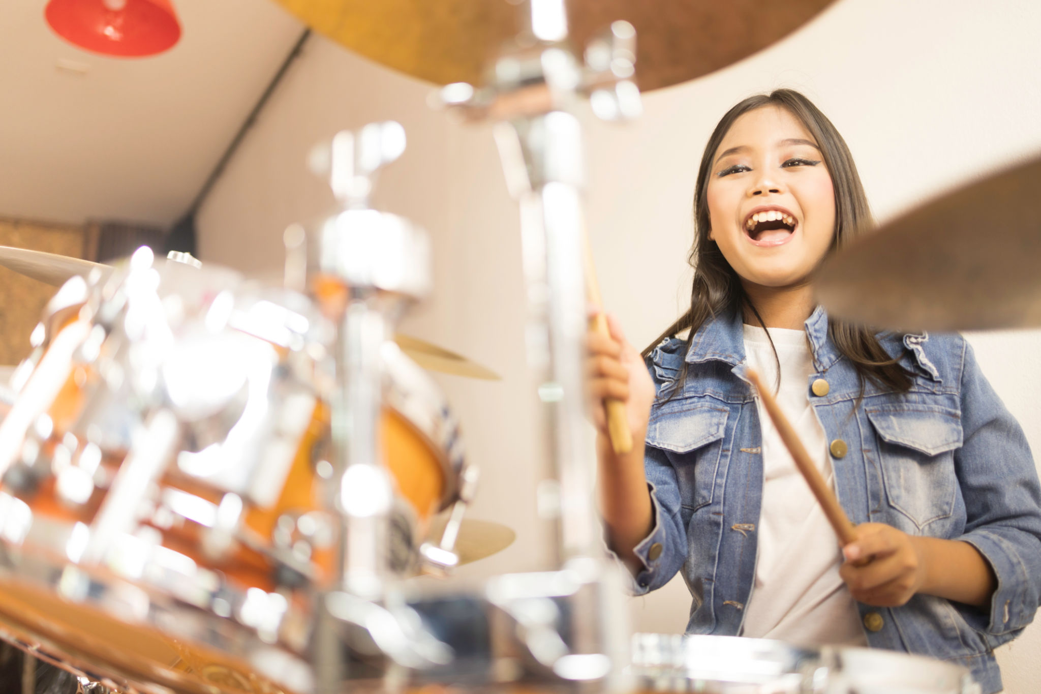 student playing drums