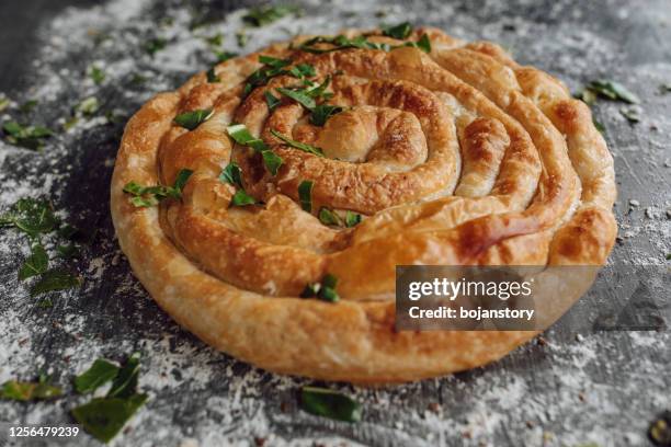 burek with cheese and spinach - spinach pie stock pictures, royalty-free photos & images