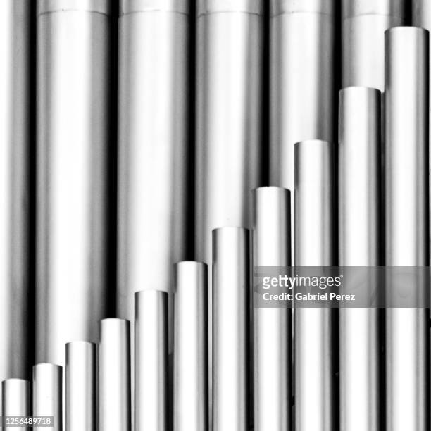 an abstract image of metal tubes - church organ fotografías e imágenes de stock