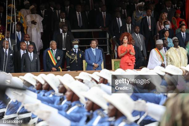 Cameroon President Paul Biya , and his wife Chantal Biya , stand during the May 20 parade marking the 51st celebration of Unity Day in Yaounde on May...