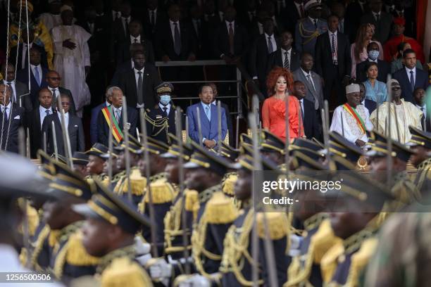 Cameroon President Paul Biya , and his wife Chantal Biya , stand during the May 20 parade marking the 51st celebration of Unity Day in Yaounde on May...