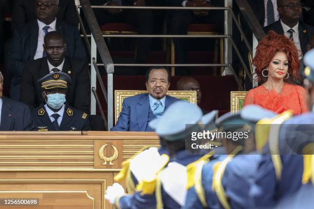 Cameroon President Paul Biya , and his wife Chantal Biya , react during the May 20 parade marking the 51st celebration of Unity Day in Yaounde on May...