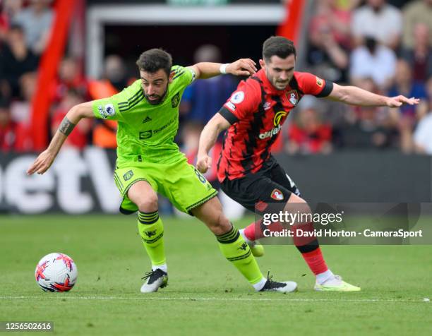 Manchester United's Bruno Fernandes under pressure from Bournemouth's Lewis Cook during the Premier League match between AFC Bournemouth and...