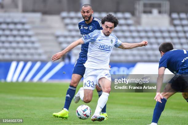 Nolan GALVES of Sochaux and Khalid BOUTAIB of Paris FC during the Ligue 2 BKT match between Paris FC and Sochaux at Stade Charlety on May 20, 2023 in...