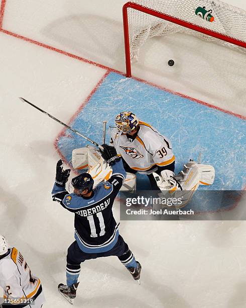 Jonathan Huberdeau of the Florida Panthers celebrates after scoring a goal against Anders Lindback of the Nashville Predators on September 19, 2011...