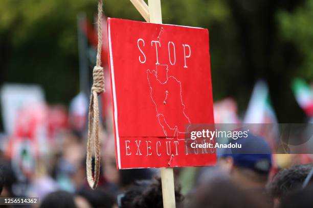 People gather at Queen's Park, Toronto to stage a protest against executions in Iran on May 20, 2023.