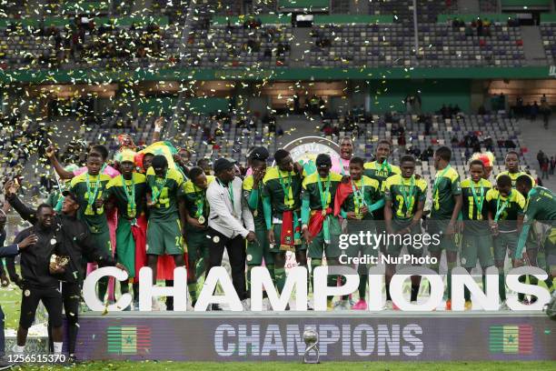 Senegal's players celebrate with the trophy during the awarding ceremony of the U17 Africa Cup of Nations at Nelson Mandela Stadium in Algiers,...
