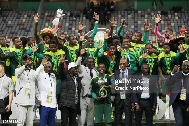 Senegal's players celebrate with the trophy during the awarding ceremony of the U17 Africa Cup of Nations at Nelson Mandela Stadium in Algiers,...