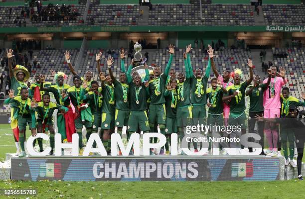 Senegal's players celebrate with the trophy during the awarding ceremony of the U17 Africa Cup of Nations at Nelson Mandela Stadium in Algiers,...