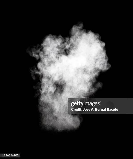 explosion by an impact of a cloud of particles of powder of white color on a black background. - colourful studio shots stock-fotos und bilder