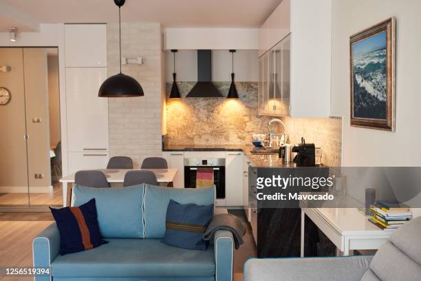 interior of the comfortable living area of a contemporary apartment - daily life in warsaw photos et images de collection
