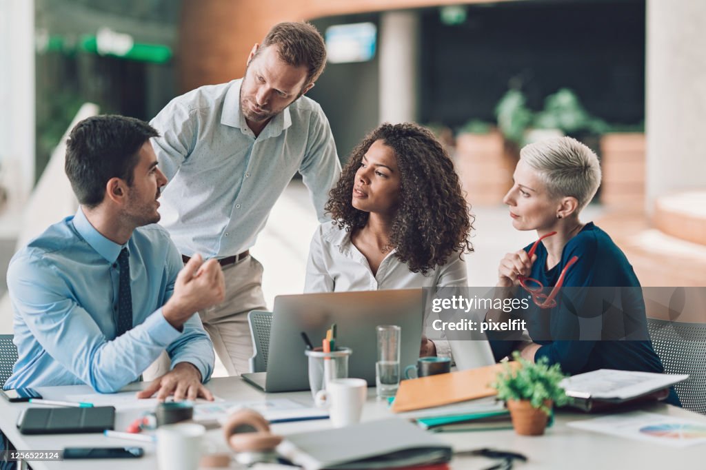Group of entrepreneurs talking on a meeting
