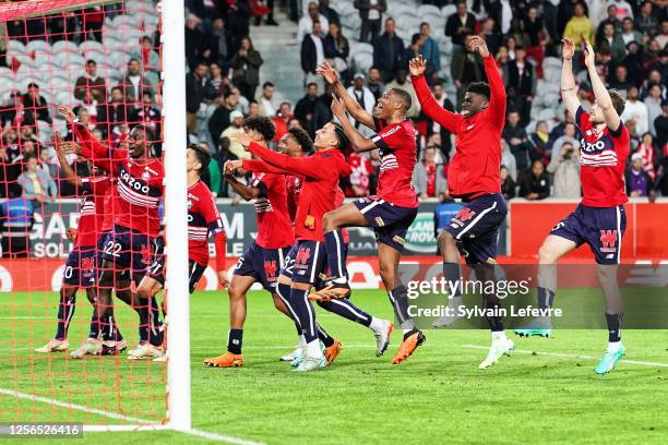 Players of Lille celebrate following victory during the Ligue 1 match between Lille OSC and Olympique Marseille at Stade Pierre-Mauroy on May 20,...