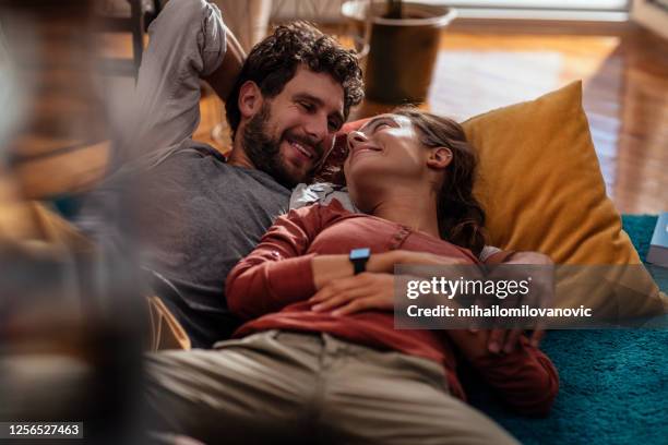 weekends were made for comfort - couple alone embracing stock pictures, royalty-free photos & images