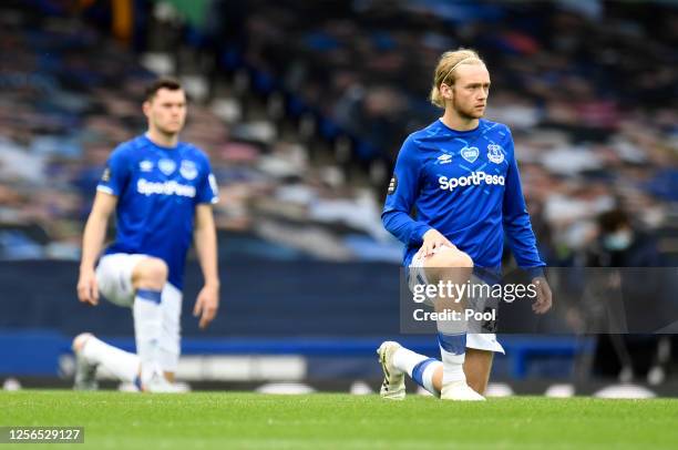 Tom Davies of Everton takes a knee in support of the black lives matter movement during the Premier League match between Everton FC and Aston Villa...