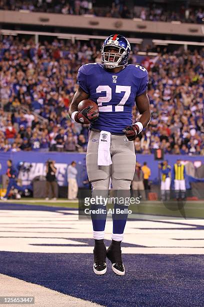 Brandon Jacobs of the New York Giants celebrates after he scored a 9-yard rushing touchdown in the third quarter against the St. Louis Rams at...
